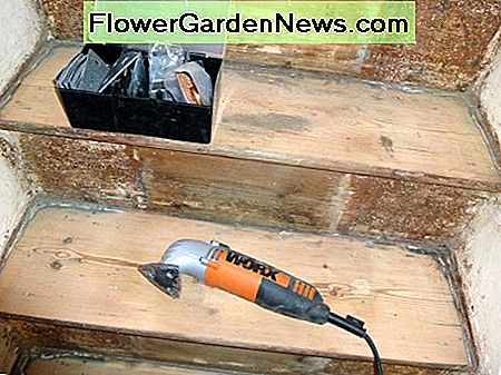 Using the sonicrafter with the sander attachment to reach the corners; after the treads had been sanded with the belt sander.