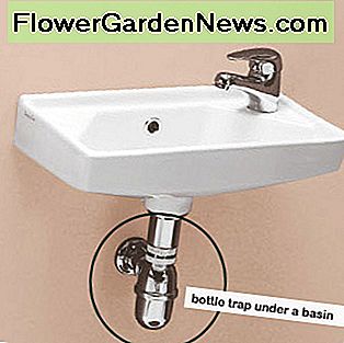 Een flessenvanger onder een aan de wand hangend bassin. A bottle trap fitted under a wall-hung basin.