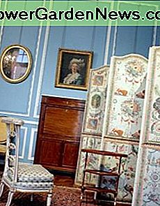 Recreation of a Rococo styled salon, City Museum of Paris .Iconic Rococo decorative elements include the soft, pastel tones, mirror, delicate furniture, cushions and illusionary motifs.