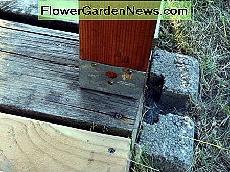 The metal fitting used to attach the post to the deck.