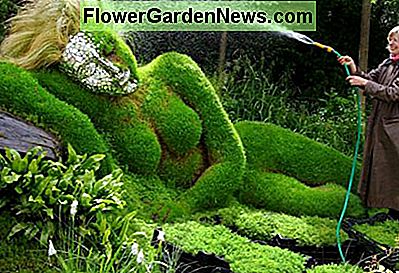 4Head Healing Garden, an entry to the Chelsea Flower Show, exhibits a reclining woman mud sculpture made by Sue and Peter Hill