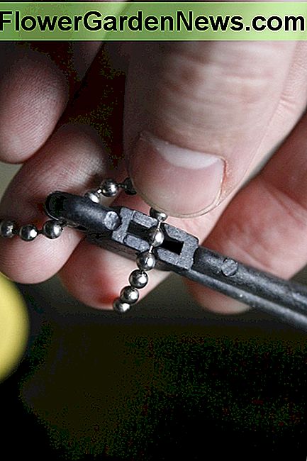 You can un-snap the chain from the lever arm and adjust the length of the chain.