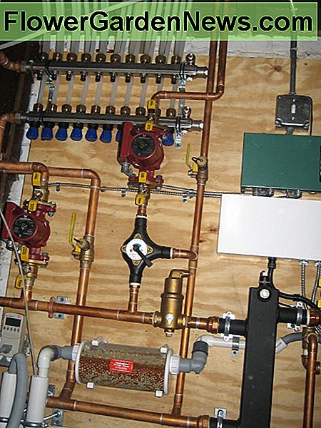 At top, a PEX distribution manifold co-exists right along with copper and other plumbing fixtures to service a boiler and radiant under floor heating system. CCL C