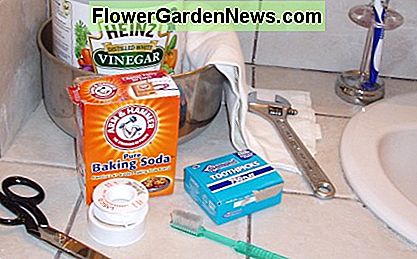 Shower head cleaning supplies: Bowl, vinegar, crescent wrench, soft cloth, baking soda, toothpicks, toothbrush, plumber's tape, and scissors to cut it.
